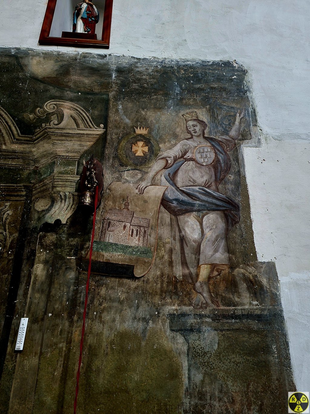 Муза з гербом Дрогобича на грудях тримає креслення майбутнього костелу
